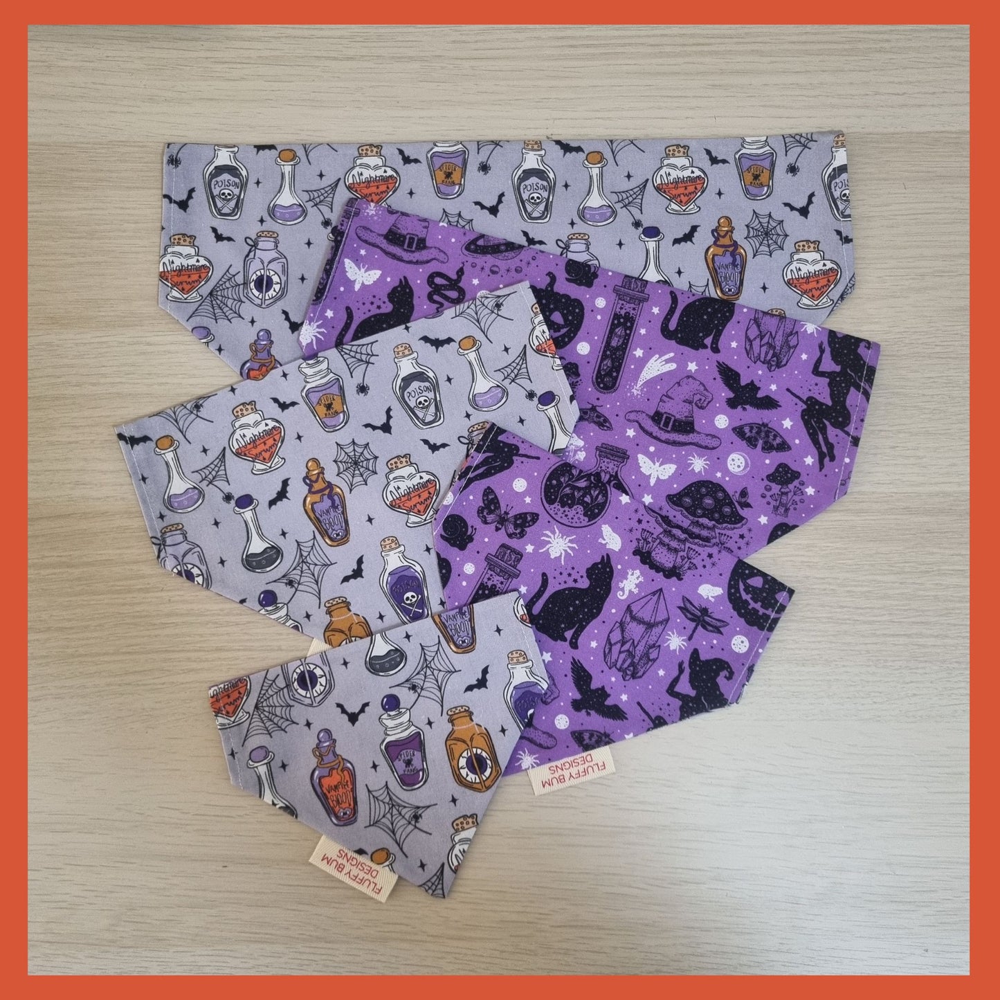 Set of Halloween-themed bandanas on a wooden surface