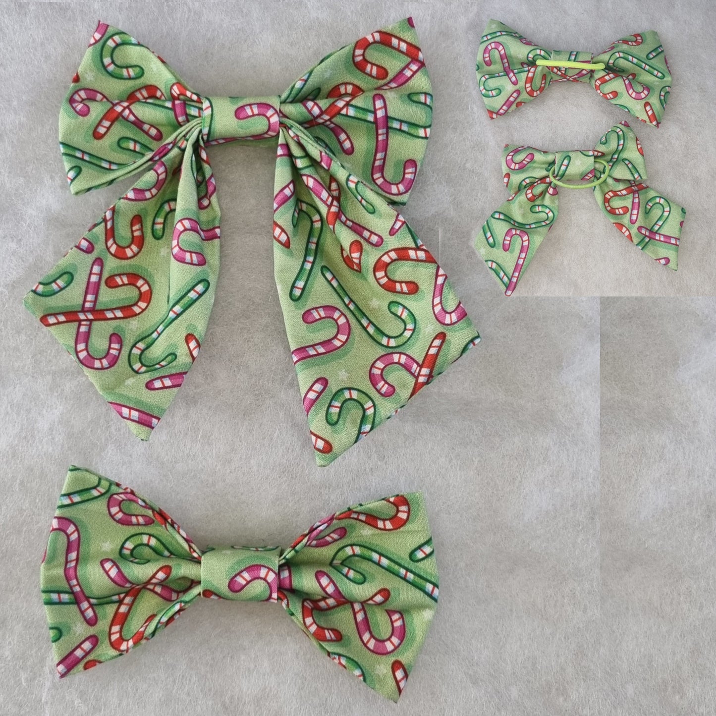 colourful candy cane bowties on green fabric - back and front view