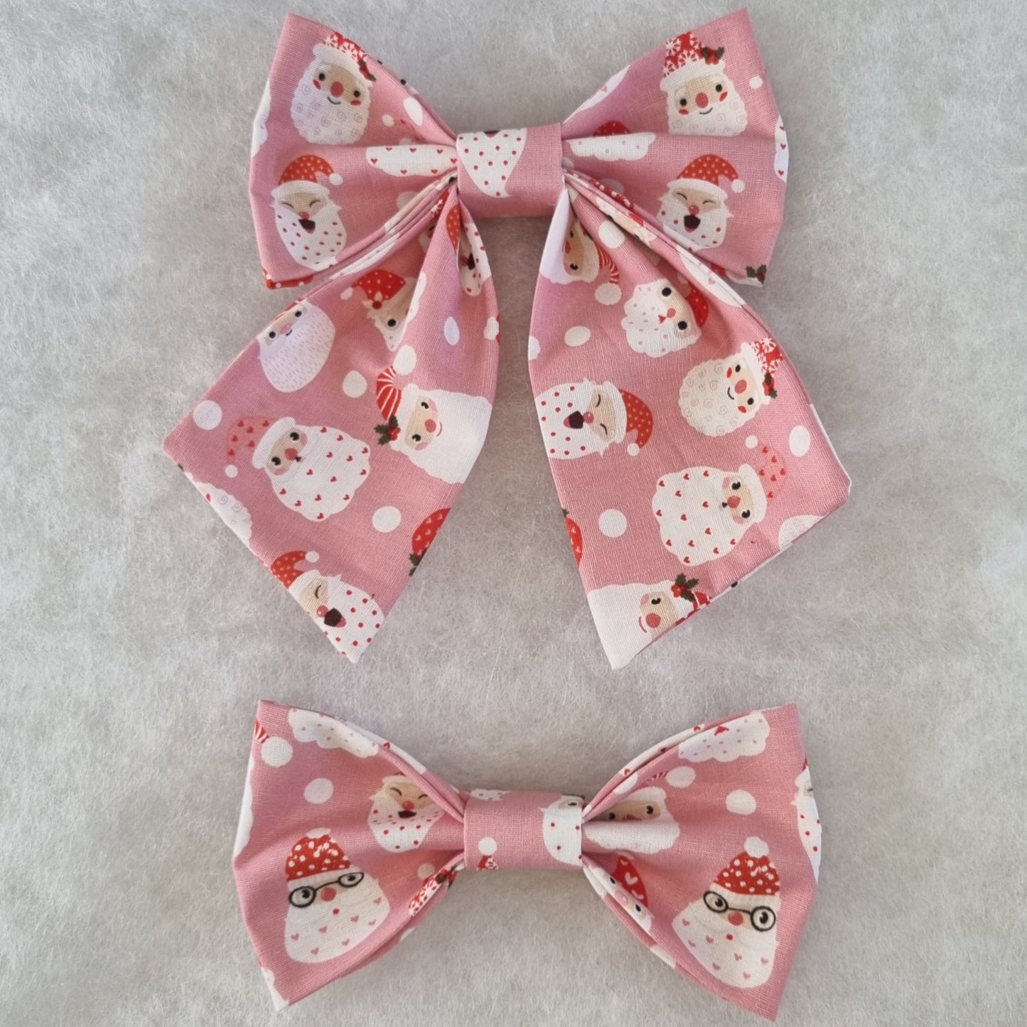 Pink with Santa Faces All Over Bowties - Large