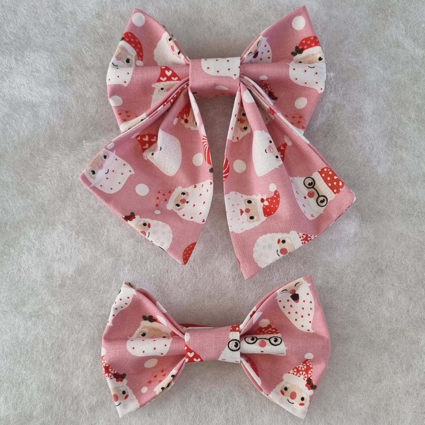 Pink with Santa Faces All Over Bowties - Medium