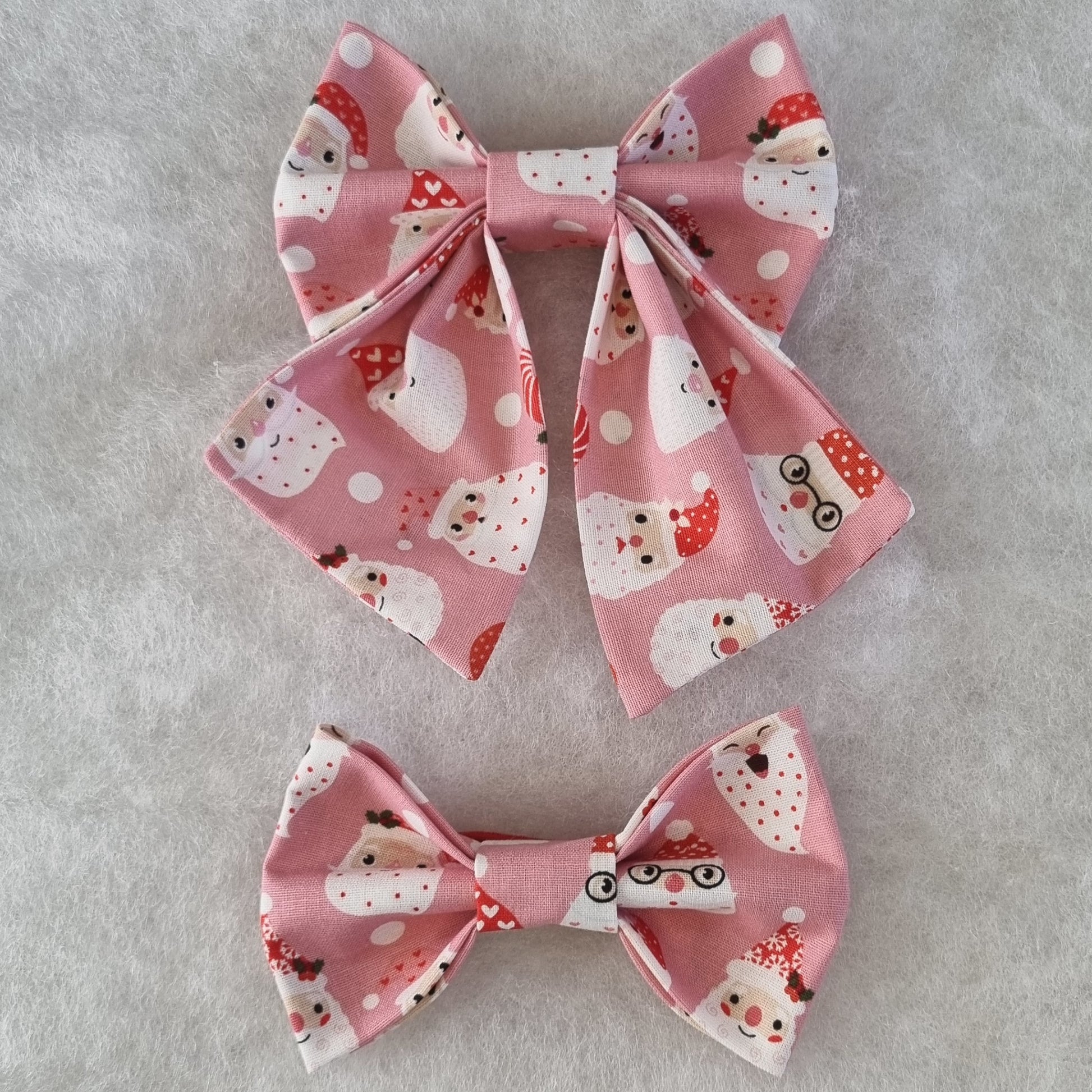 Pink with Santa Faces All Over Bowties - Medium