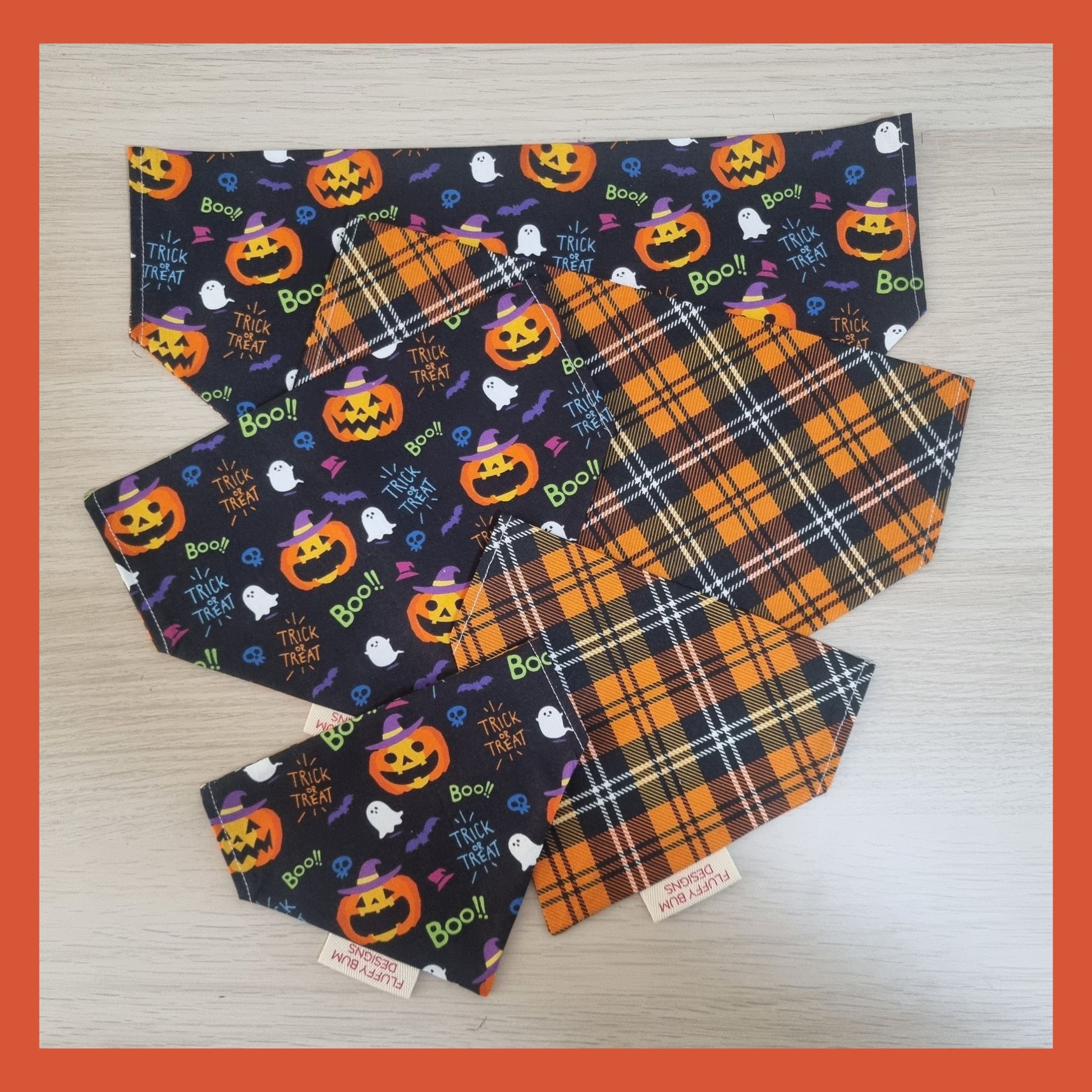 Halloween-themed pet bandanas with pumpkins, ghosts, and text 